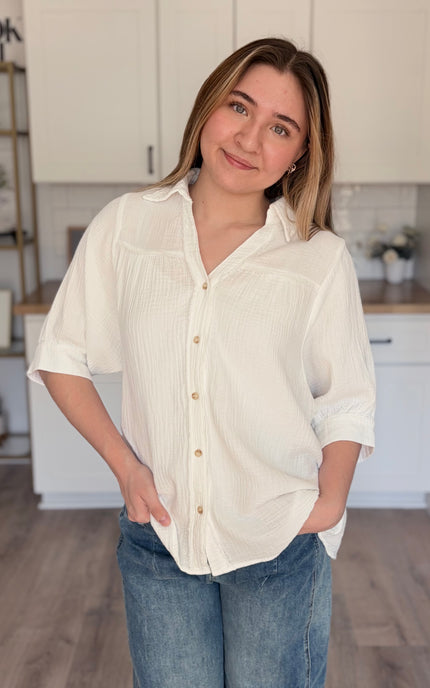 Model wearing Marin cotton gauze button down shirt with relaxed fit and half sleeves