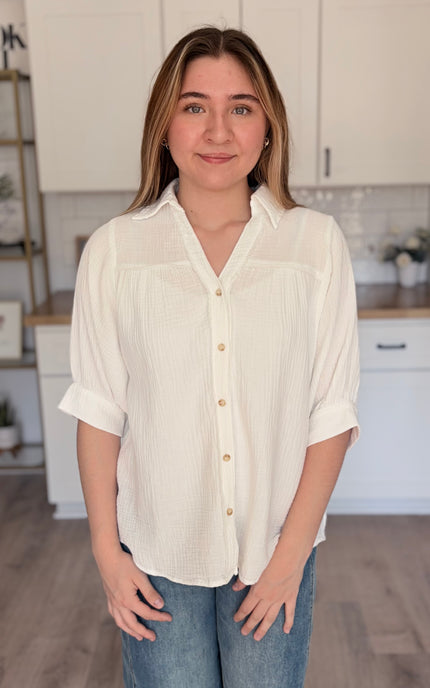 Model wearing Marin cotton gauze button down shirt with relaxed fit and half sleeves