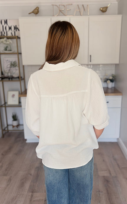 Model wearing Marin cotton gauze button down shirt with relaxed fit and half sleeves
