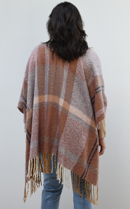 Mauve Meadow Ruana on soft linen background, featuring brushed knit texture and mauve-neutral stripes.