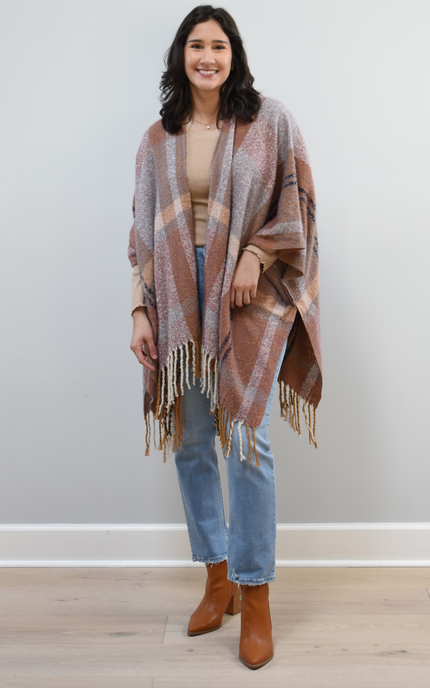 Mauve Meadow Ruana on soft linen background, featuring brushed knit texture and mauve-neutral stripes.