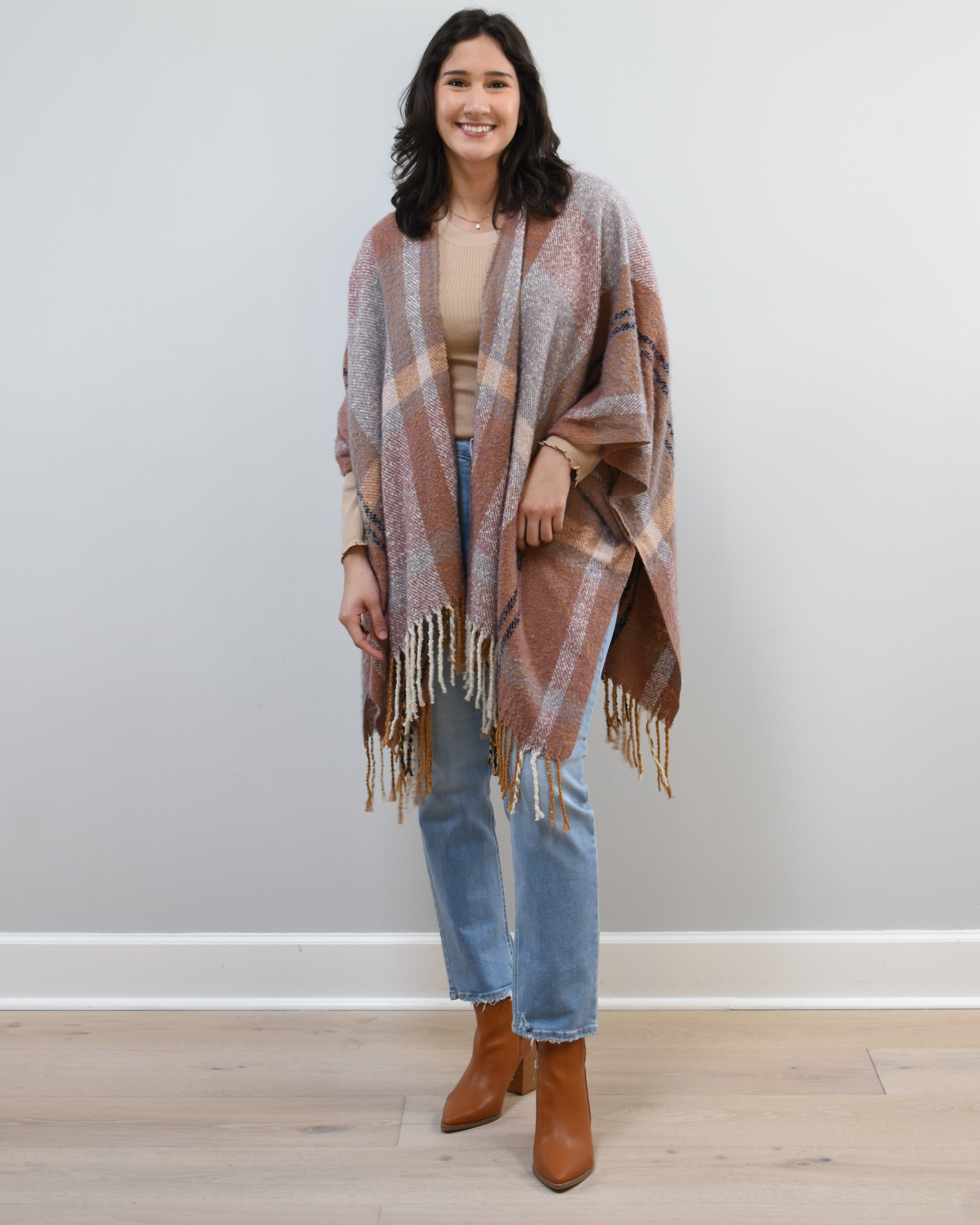 Mauve Meadow Ruana on soft linen background, featuring brushed knit texture and mauve-neutral stripes.