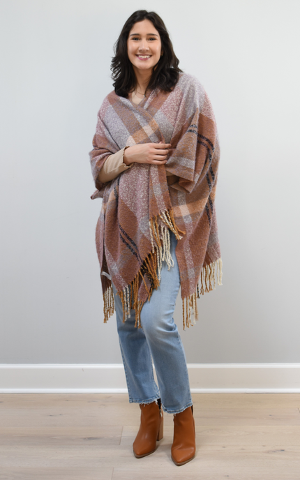 Mauve Meadow Ruana on soft linen background, featuring brushed knit texture and mauve-neutral stripes.