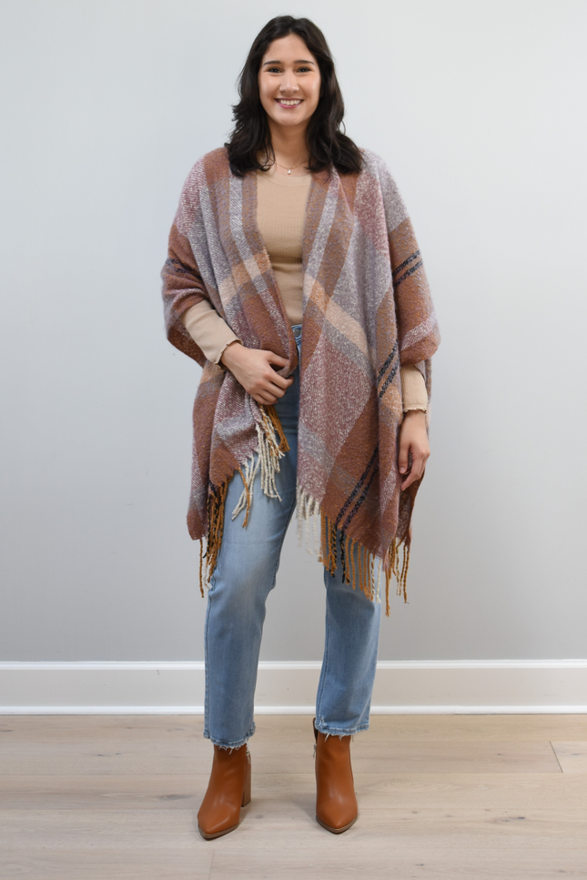 Mauve Meadow Ruana on soft linen background, featuring brushed knit texture and mauve-neutral stripes.