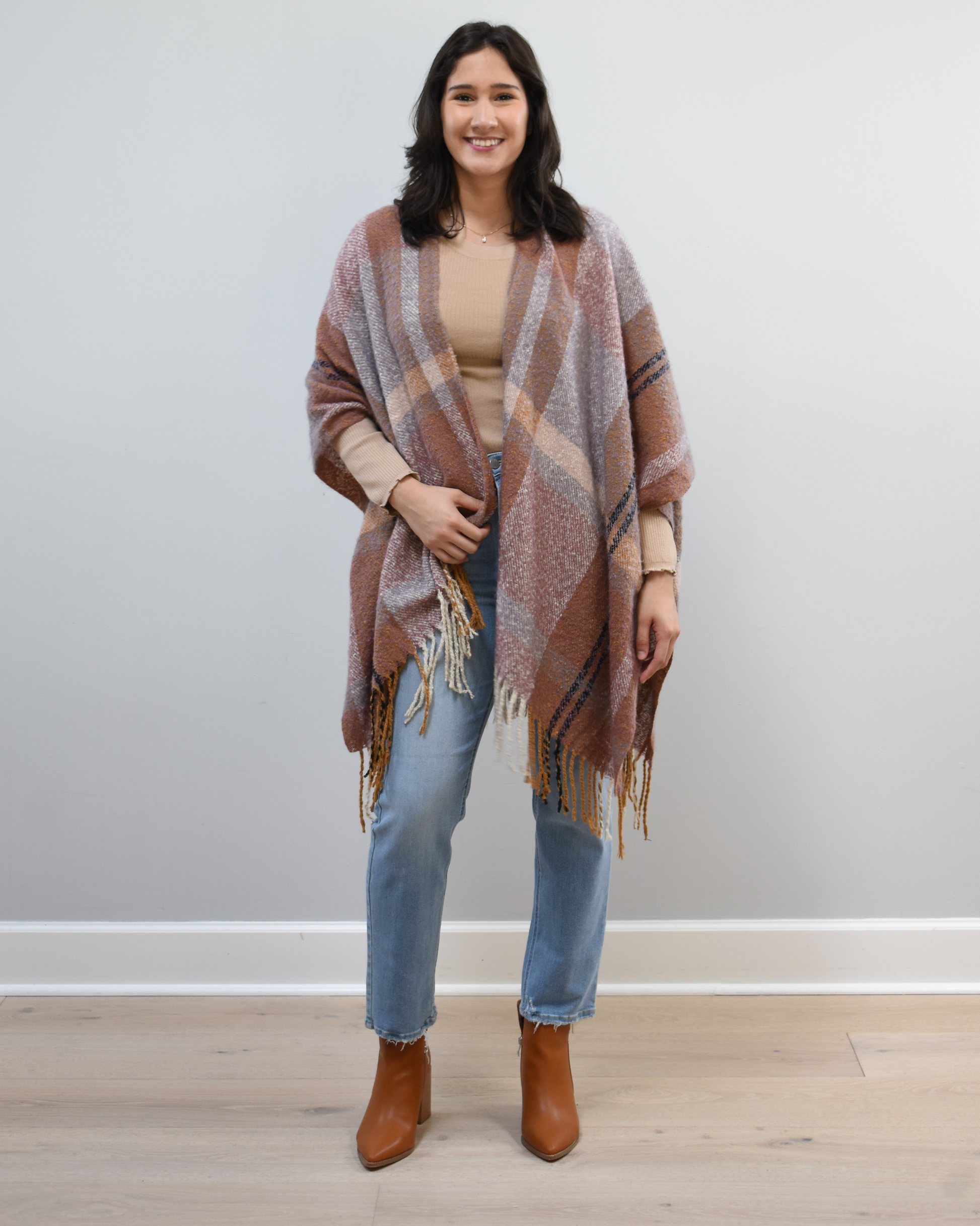 Mauve Meadow Ruana on soft linen background, featuring brushed knit texture and mauve-neutral stripes.