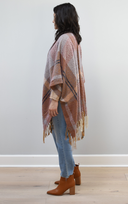 Mauve Meadow Ruana on soft linen background, featuring brushed knit texture and mauve-neutral stripes.