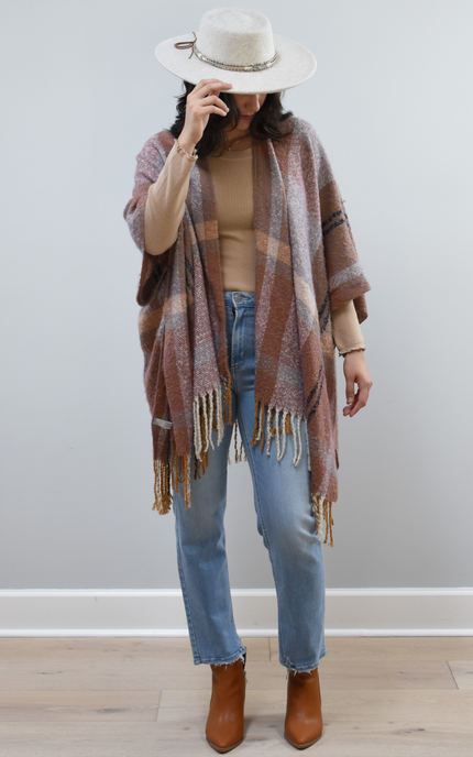 Mauve Meadow Ruana on soft linen background, featuring brushed knit texture and mauve-neutral stripes.