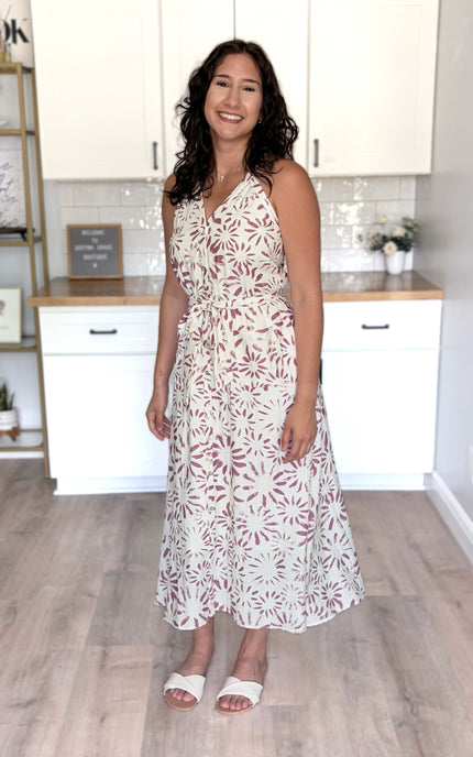 Side angle of halter midi dress showing midi length and lightweight fabric movement