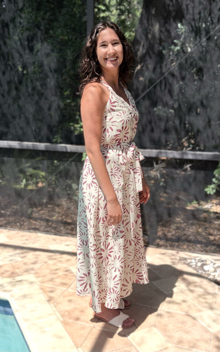 Side view of abstract floral halter dress showing graceful flow and movement through skirt