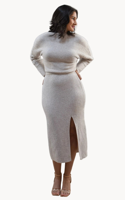 Midi one-shoulder sweater dress on soft linen background, featuring soft stretchy knit and elegant silhouette.