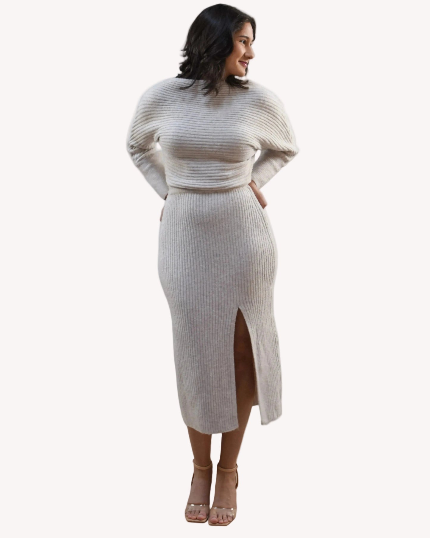 Midi one-shoulder sweater dress on soft linen background, featuring soft stretchy knit and elegant silhouette.