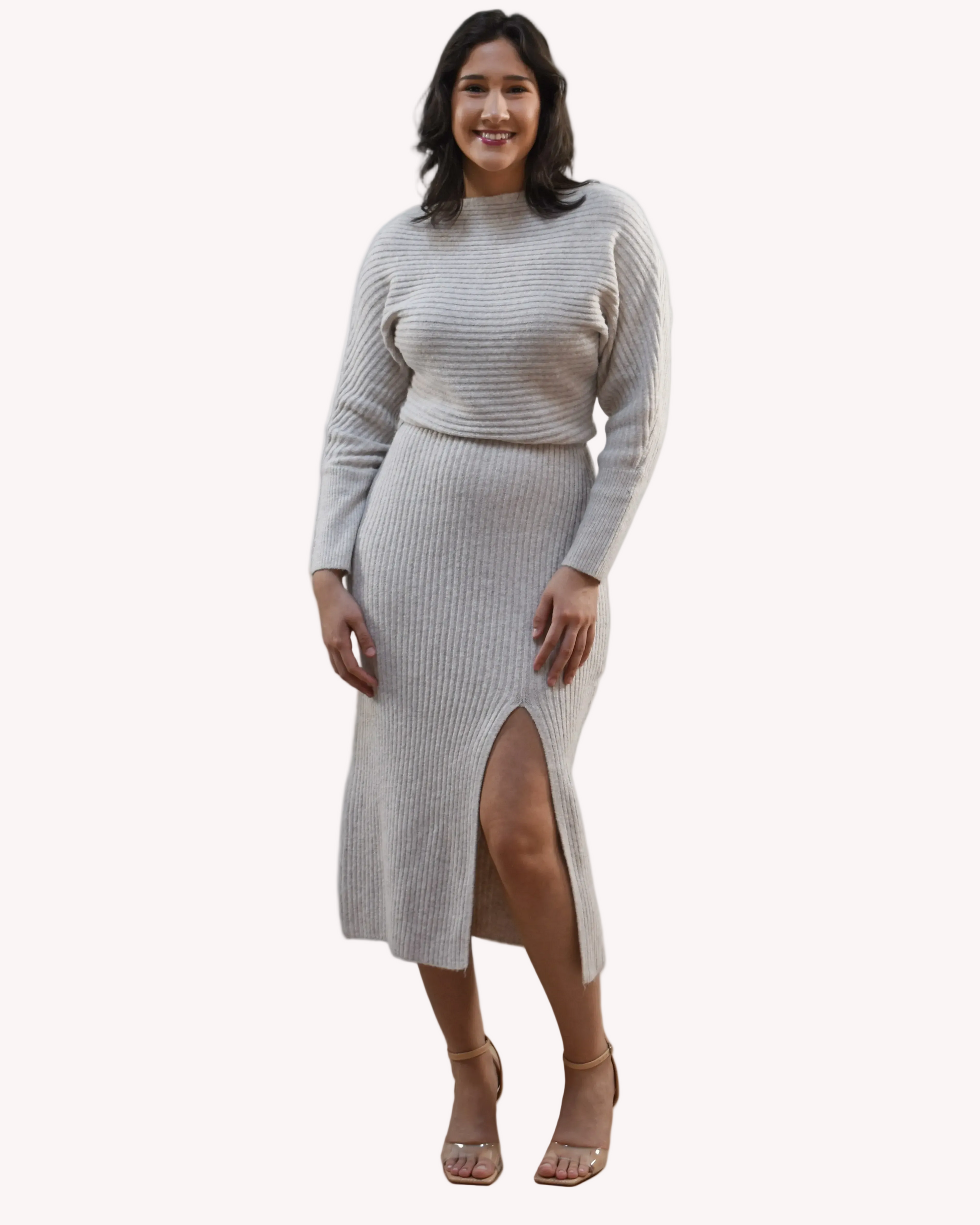 Midi one-shoulder sweater dress on soft linen background, featuring soft stretchy knit and elegant silhouette.