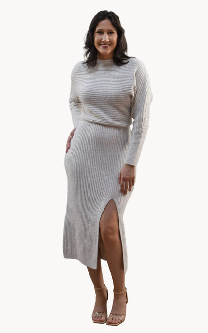 Midi one-shoulder sweater dress on soft linen background, featuring soft stretchy knit and elegant silhouette.