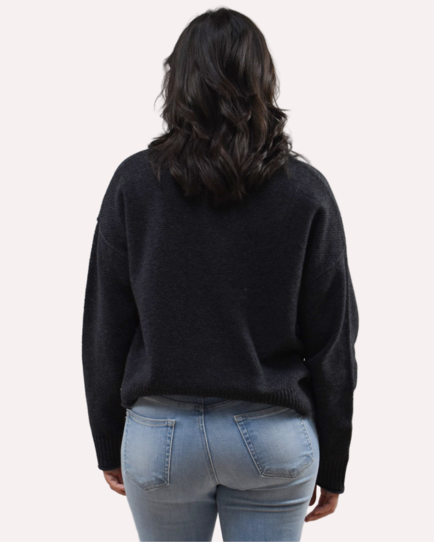 Neutral mock neck long-sleeve sweater top on soft linen background, made from a cozy knit blend.