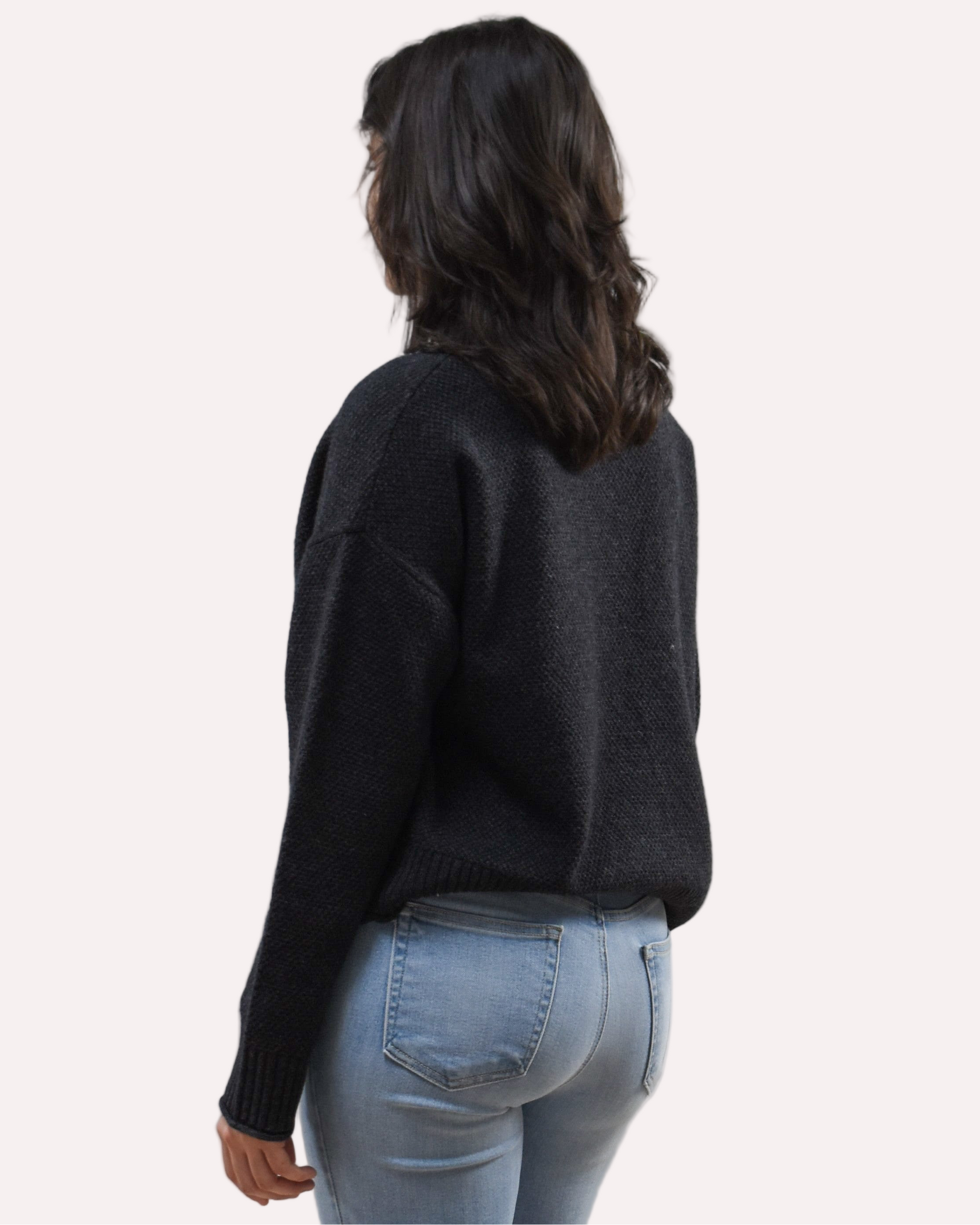 Neutral mock neck long-sleeve sweater top on soft linen background, made from a cozy knit blend.