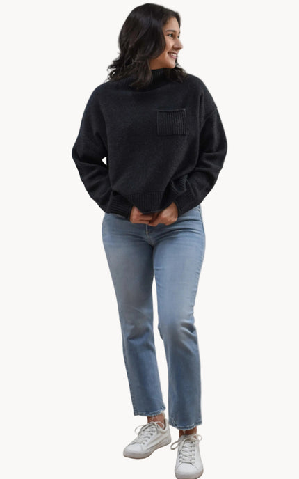 Neutral mock neck long-sleeve sweater top on soft linen background, made from a cozy knit blend.