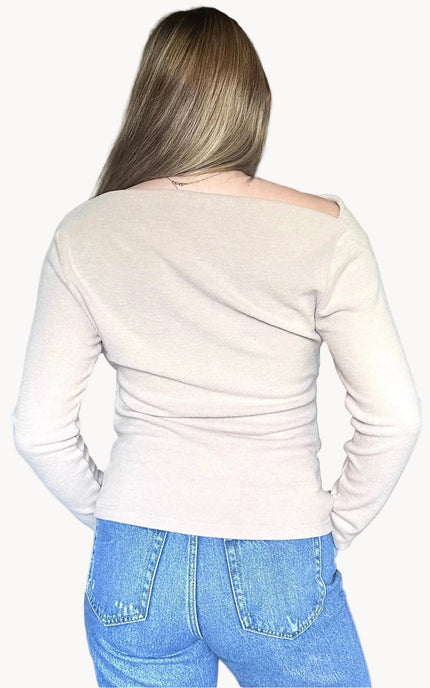 Back view of off shoulder knit top with smooth, fitted silhouette