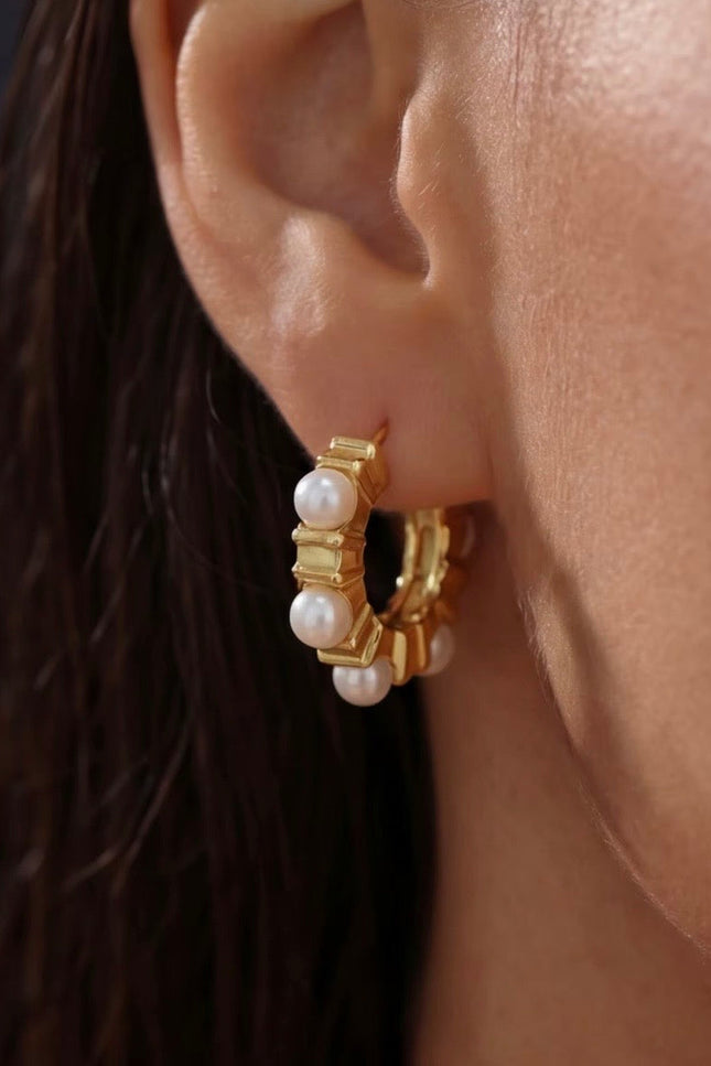 18k gold PVD stainless steel hoop earrings with soft glass pearl accents, lightweight hypoallergenic design.