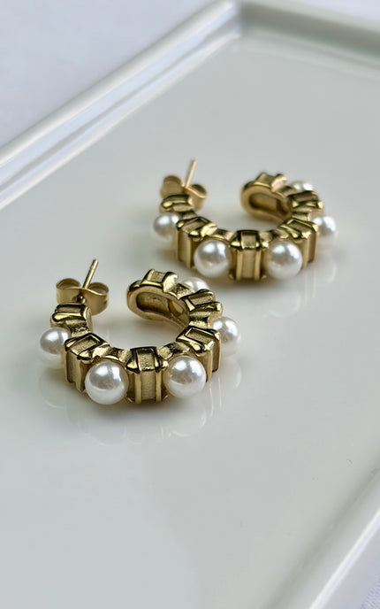 Timeless gold hoops adorned with luminous pearls. Crafted for comfort, durability, and effortless sophistication.