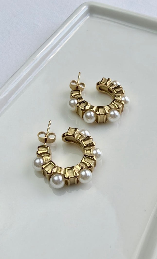 Classic gold hoops with delicate pearl accents. Lightweight, durable, hypoallergenic, and made for everyday wear.