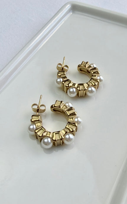 Classic gold hoops with delicate pearl accents. Lightweight, durable, hypoallergenic, and made for everyday wear.