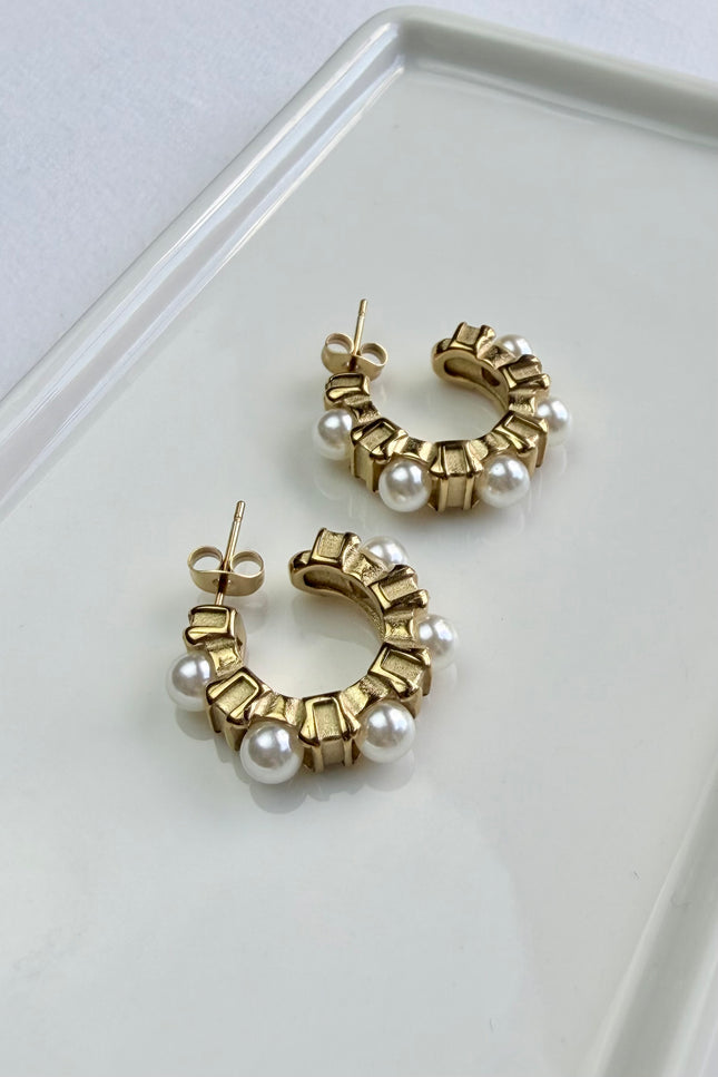 Classic gold hoops with delicate pearl accents. Lightweight, durable, hypoallergenic, and made for everyday wear.
