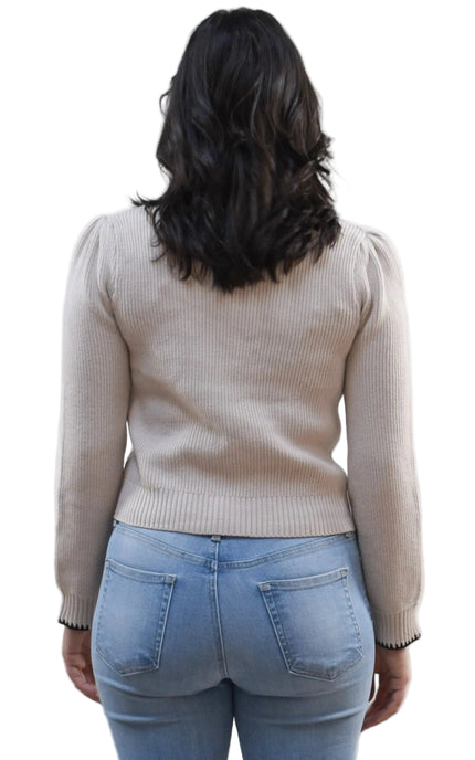 Petite Bow Knit Cardi on soft linen background, featuring a contrast-knit body and delicate bow detail at the neckline.