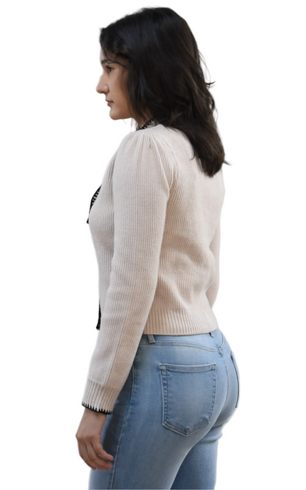 Petite Bow Knit Cardi on soft linen background, featuring a contrast-knit body and delicate bow detail at the neckline.