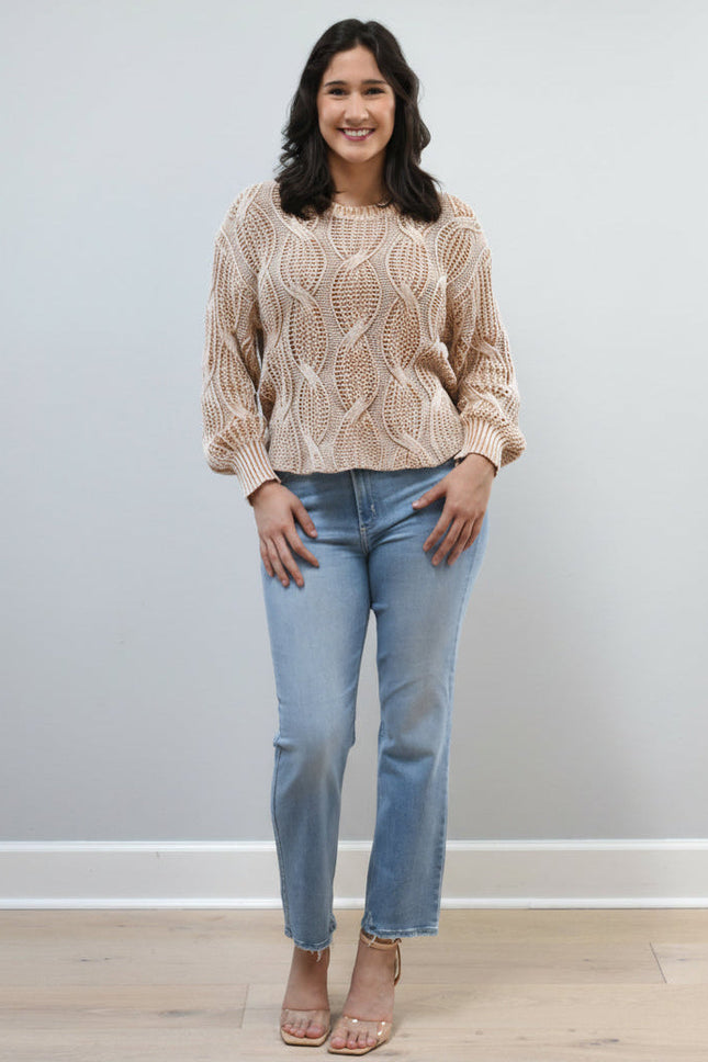 Light-wash straight-leg jeans with mid-high rise shown from the front on model, styled with neutral top.
