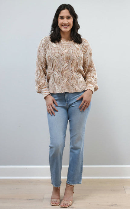 Light-wash straight-leg jeans with mid-high rise shown from the front on model, styled with neutral top.
