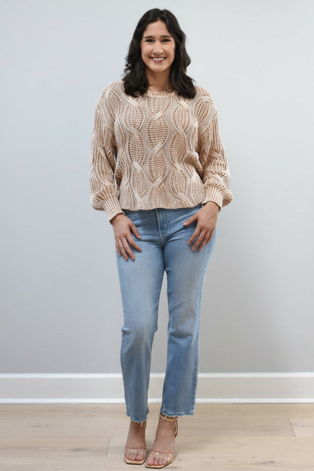 Light-wash straight-leg jeans with mid-high rise shown from the front on model, styled with neutral top.