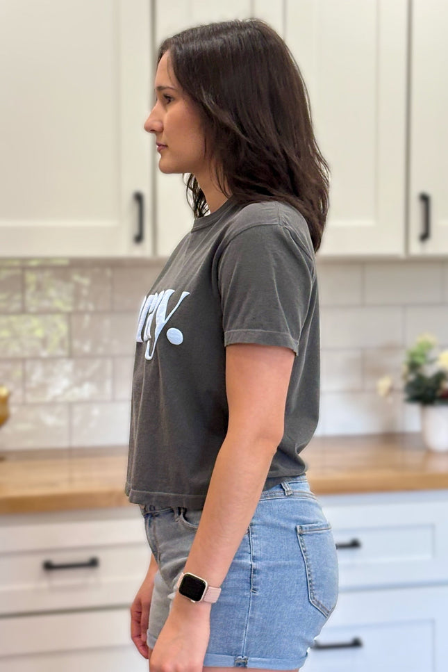 Charcoal gray cropped tee with bold ‘pray.’ text — modern faith graphic tee from Justyna Grace Boutique.