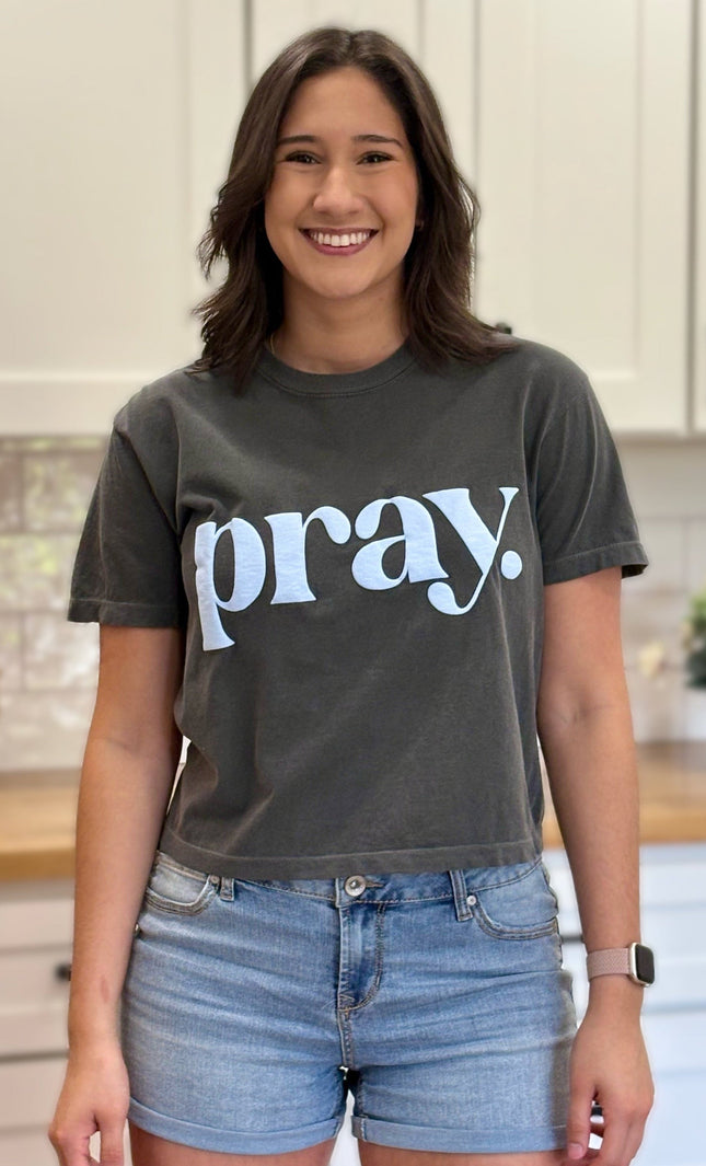 Charcoal gray cropped tee with bold ‘pray.’ text — modern faith graphic tee from Justyna Grace Boutique.