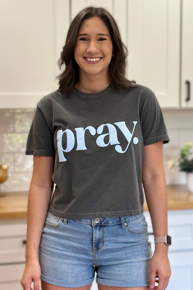 Charcoal gray cropped tee with bold ‘pray.’ text — modern faith graphic tee from Justyna Grace Boutique.