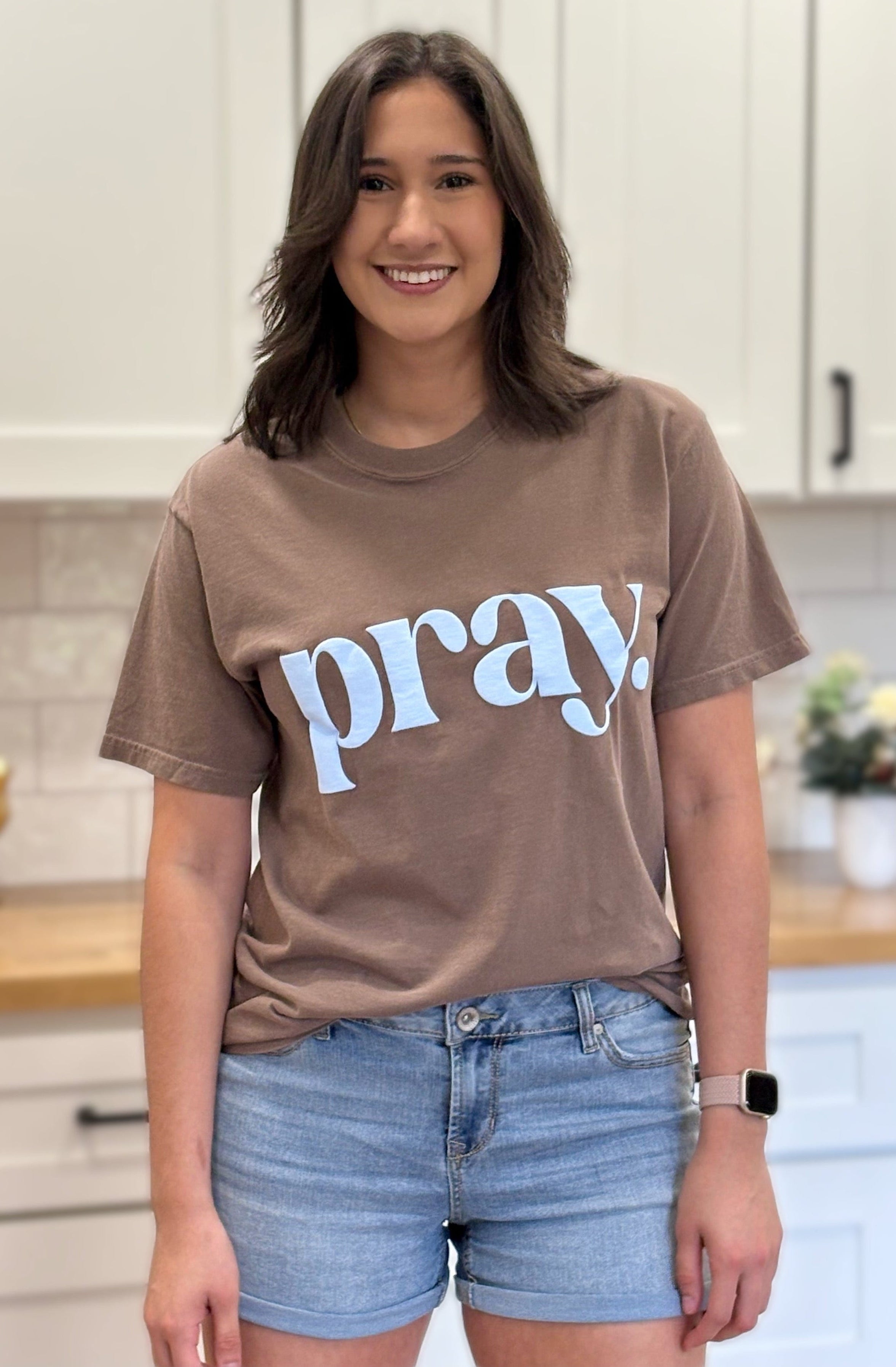 “Pray.” faith graphic tee with soft cotton fabric, textured print, and relaxed fit.