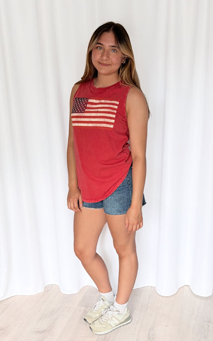 Vintage graphic tank on model displaying authentic worn-in look and flattering fit