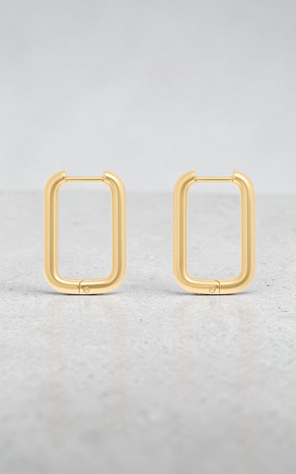 Modern rectangular huggie hoops displayed flat, showing sleek structured silhouette