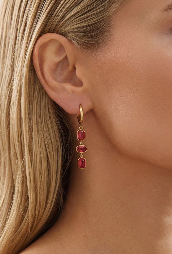 Bold feminine red crystal earrings styled for everyday wear