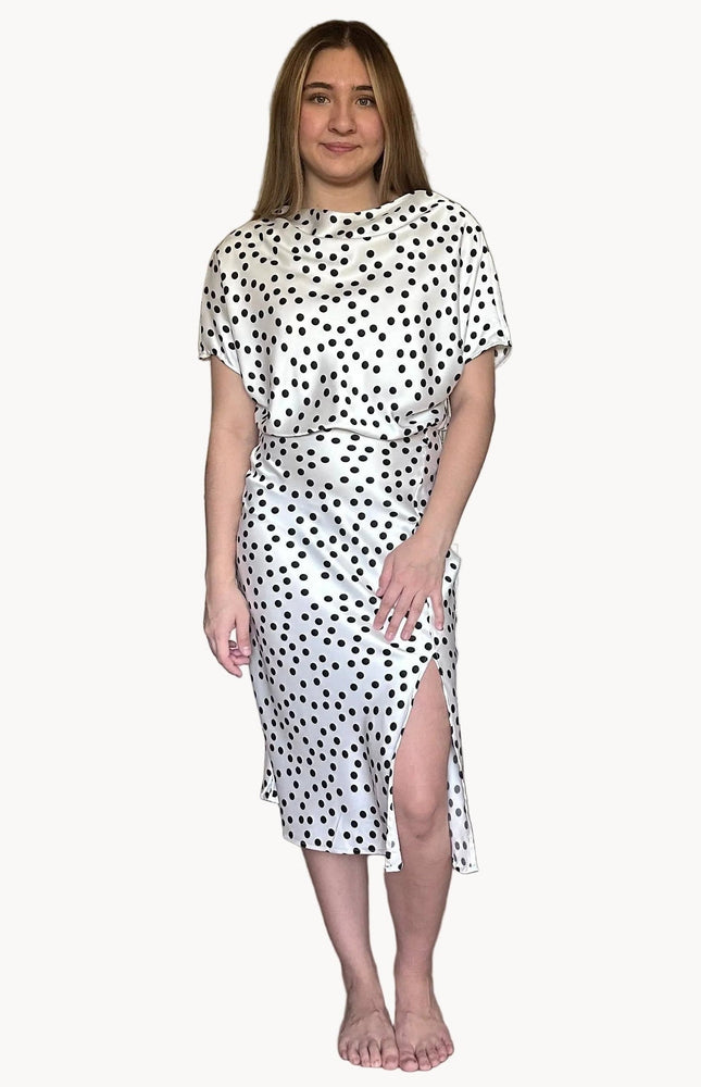 Renee C polka dot dress with side slit and flattering fitted silhouette