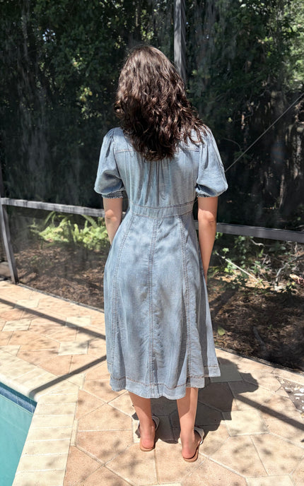 Back view of the Tencel maxi dress showing the elegant drape and smooth, silky finish of the sustainable fabric.