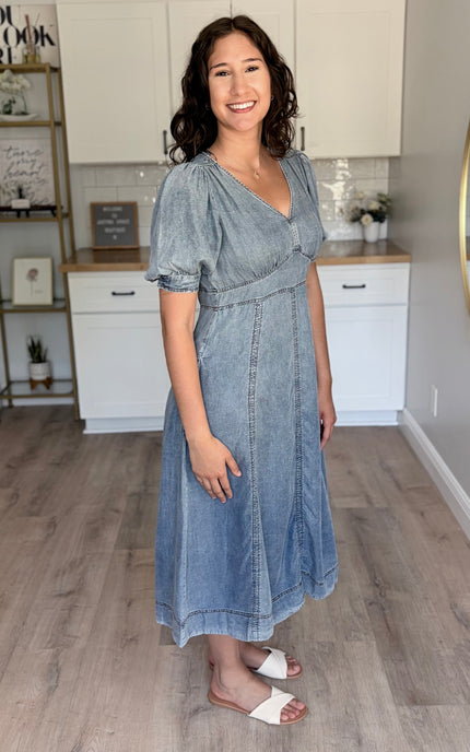 Side profile of a 5'8" model wearing the Tencel puff sleeve maxi, highlighting the fluid movement and comfortable fit.