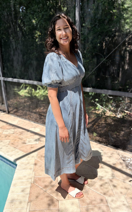Side profile of a 5'8" model wearing the Tencel puff sleeve maxi, highlighting the fluid movement and comfortable fit.