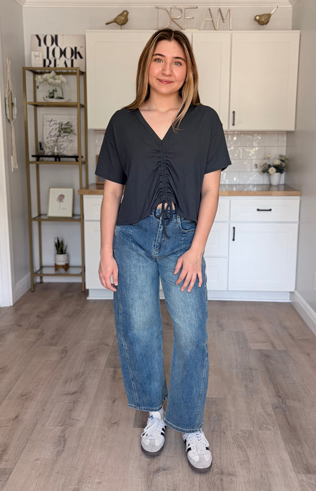 Model wearing Rowan Baggy Jeans in vintage wash with oversized baggy fit and soft stretch denim