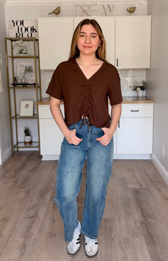 Model wearing Rowan Baggy Jeans in vintage wash with oversized baggy fit and soft stretch denim