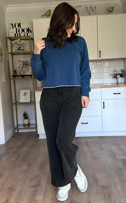 Oversized denim-wash sweatshirt with relaxed drape and laid-back fit