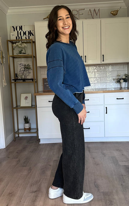 Oversized denim-wash sweatshirt with relaxed drape and laid-back fit