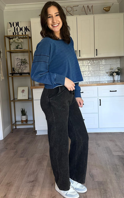 Oversized denim-wash sweatshirt with relaxed drape and laid-back fit