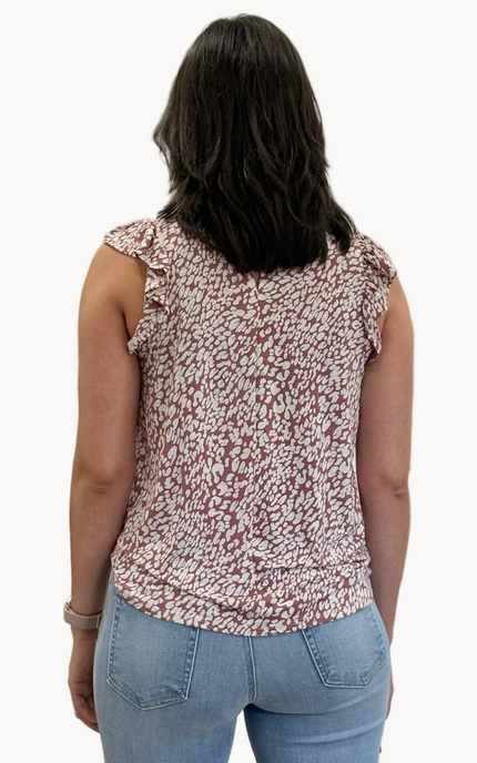 Ruffle Mock Neck Animal Print Top — sleeveless knit blouse with ruffle trim and keyhole back from Justyna Grace Boutique.