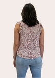 Ruffle Mock Neck Animal Print Top — sleeveless knit blouse with ruffle trim and keyhole back from Justyna Grace Boutique.