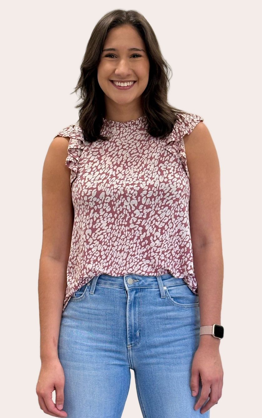Ruffle Mock Neck Animal Print Top — sleeveless knit blouse with ruffle trim and keyhole back from Justyna Grace Boutique.